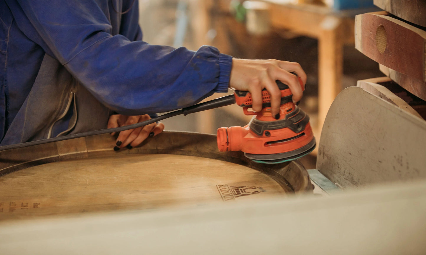 The finishing touches like sanding the barrel. 