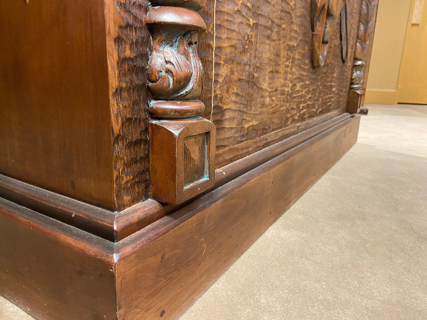 Close up of bottom of front of bar, showing hand carved and hand tooled  details