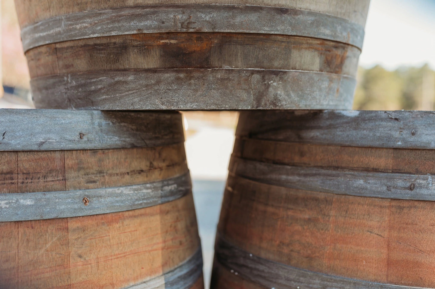 Barrels stacked up outside.