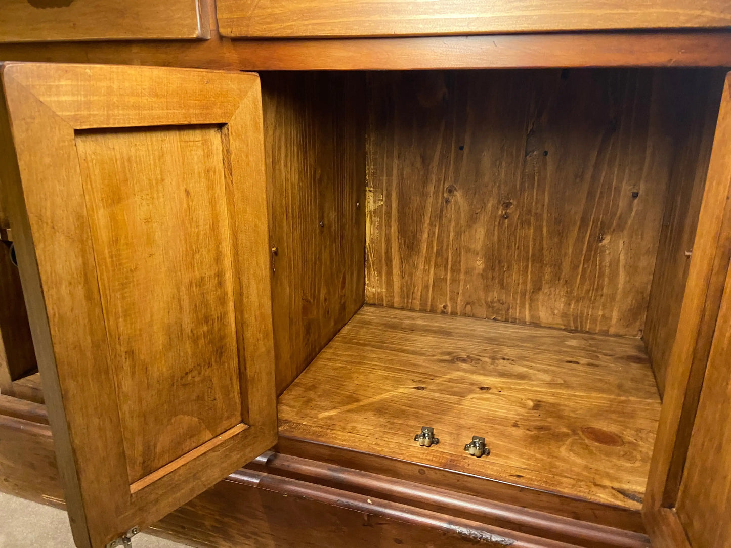 Close up of inside of closed cabinet in the back of the bar. All solid wood.