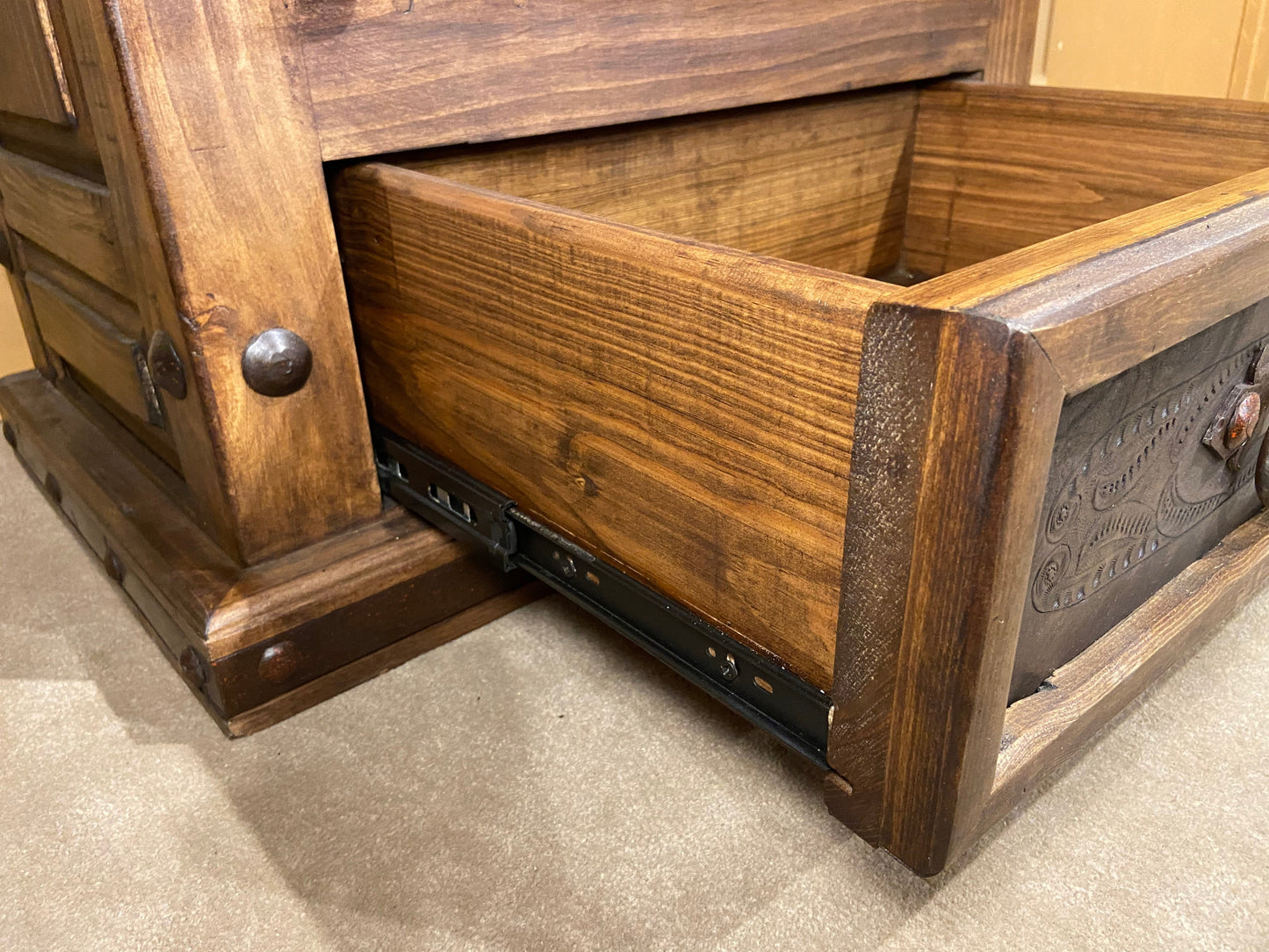 Side angle of drawer showing hardware used for soft closing drawer