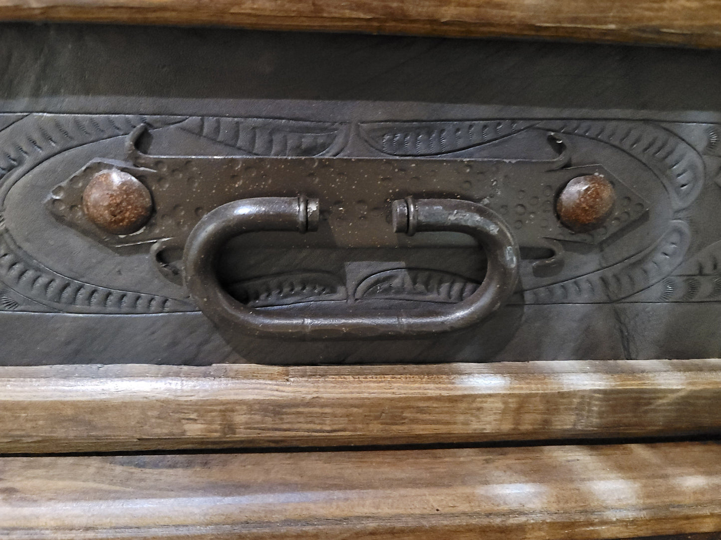 closeup of ironwork and handle on drawer 